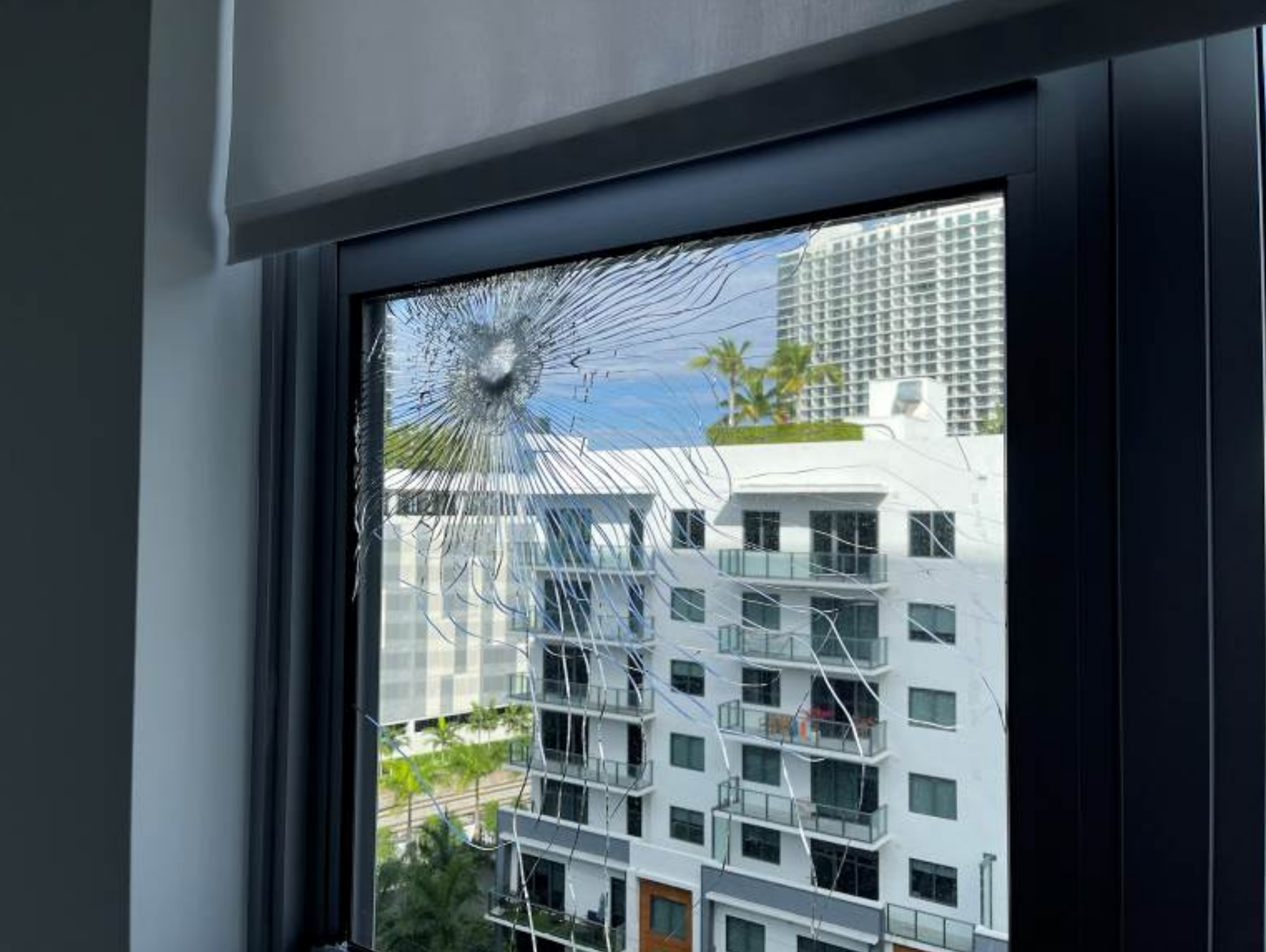Damaged window pane of apartment unit